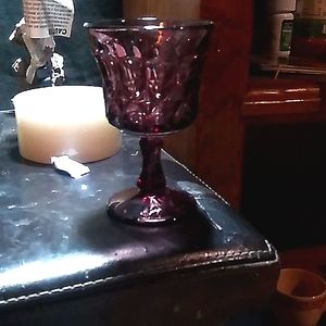 7 beautiful purple glass wine glasses I believe they are AVON glass. Perfect